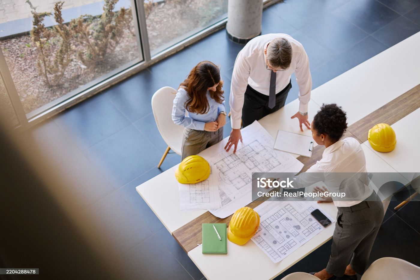 Hawkins-Weir team reviewing blueprints